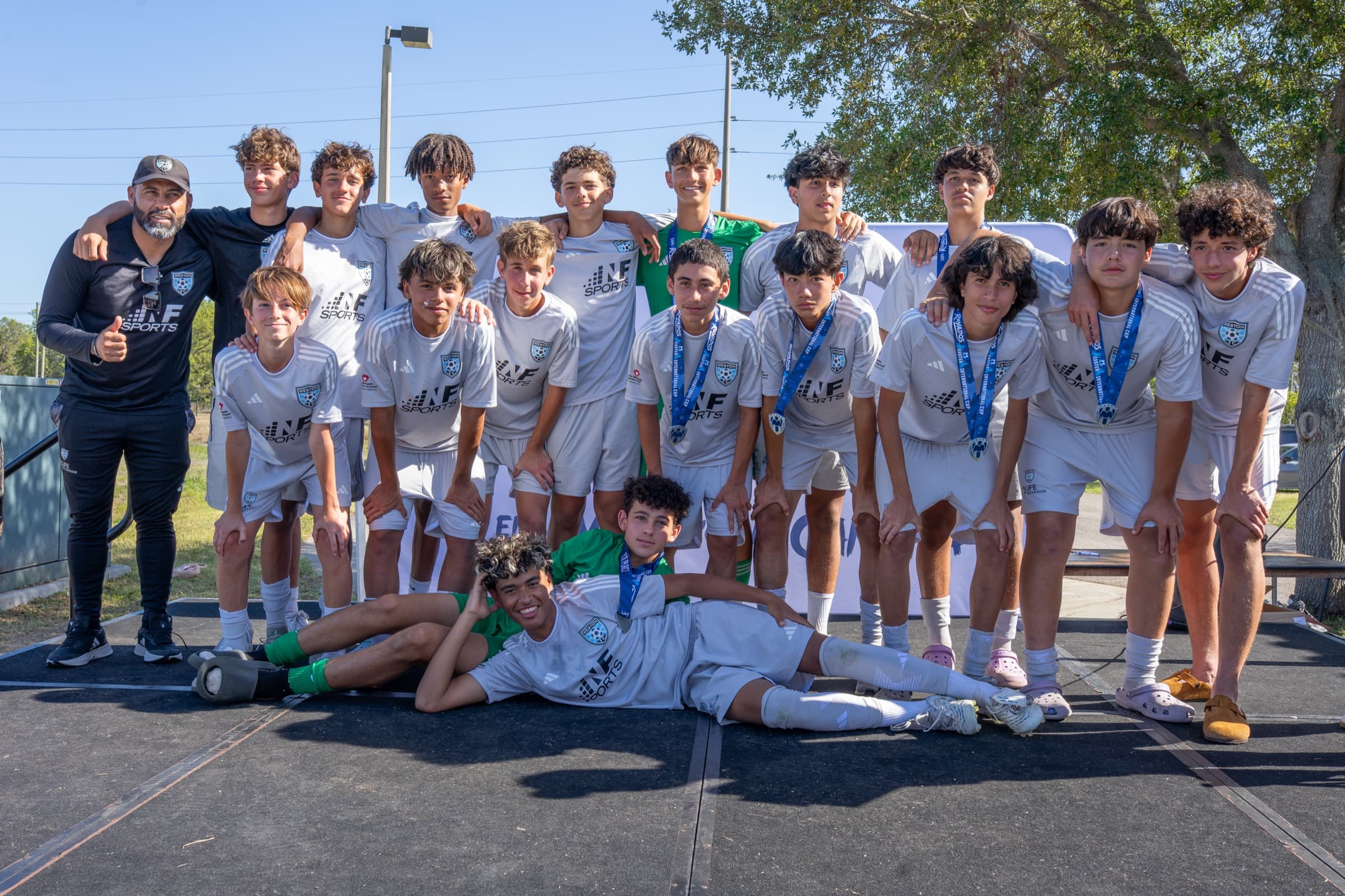 A youth soccer team together after tournament play