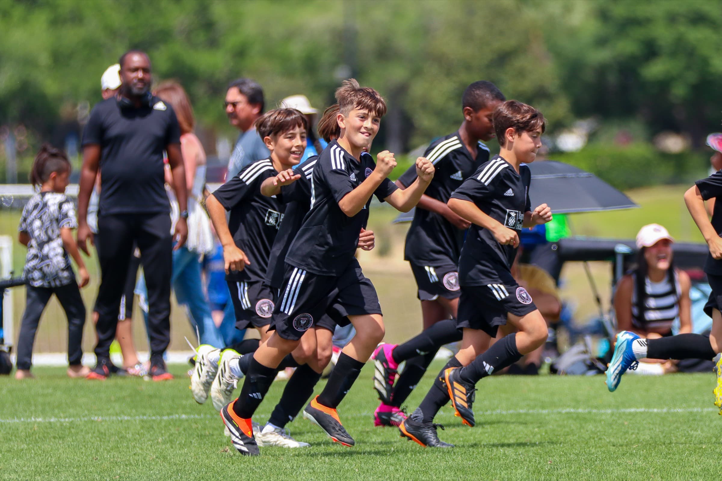 Young soccer players running together from the PSS photo collection